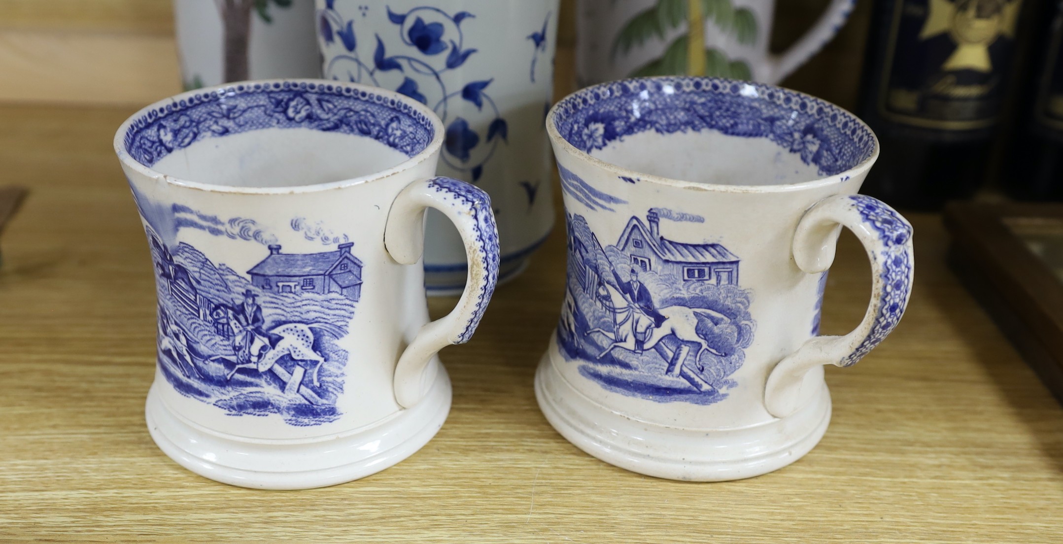 A pair of German 17th century faience pewter mounted steins, together with a selection of blue and white ceramics, tallest 26cm